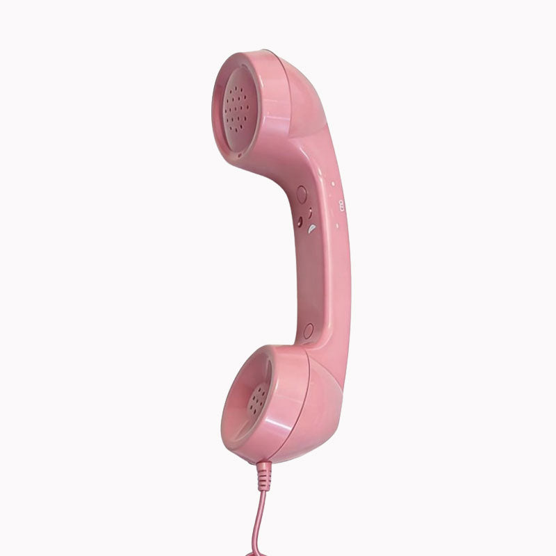 Retro telephone handset on modern desk